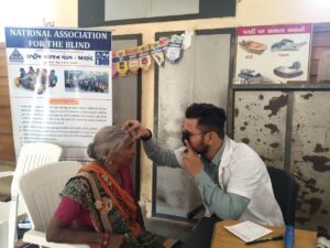 This image captures a free eye check-up camp organized by the National Association for the Blind (NAB), Anand branch.